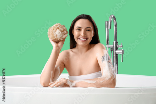 Young woman with loofah tak...