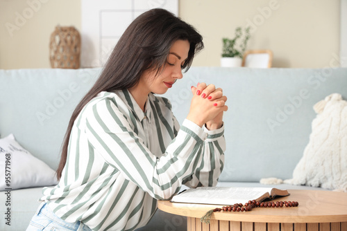 Religious young woman with ...