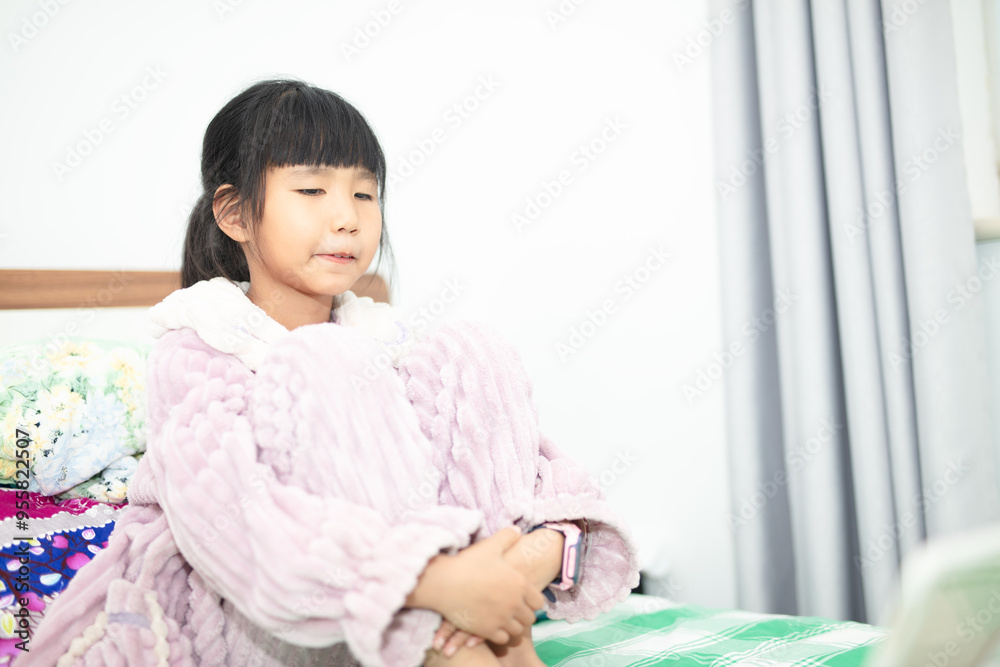 Little girl watching iPad on bed Little girl watching iPad on bed