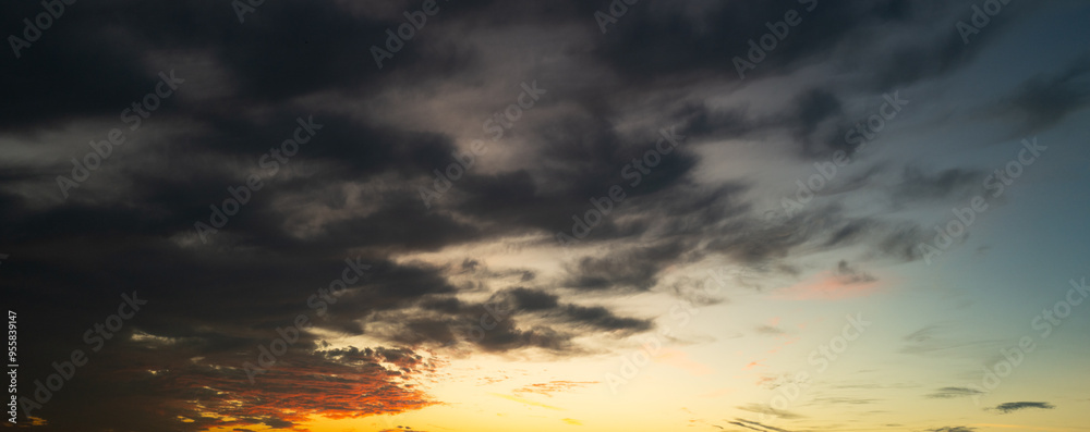 Tropical sunset. Beautiful sunset sky with clouds. Orange sunset, dark clouds in sky. Background of dark clouds before storm. Dramatic clouds. Apocalyptic sky, dark cloud. Overcast background. Tropical sunset. Beautiful sunset sky with clouds. Orange sunset, dark clouds in sky. Background of dark clouds before storm. Dramatic clouds. Apocalyptic sky, dark cloud. Overcast background.