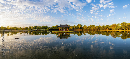 Buyeo-gun, Chungcheongnam-do, South Korea - August 7, 2021: Panoramic and summer view of a pavilion on Gungnamji Pond with cloud reflection on water photo