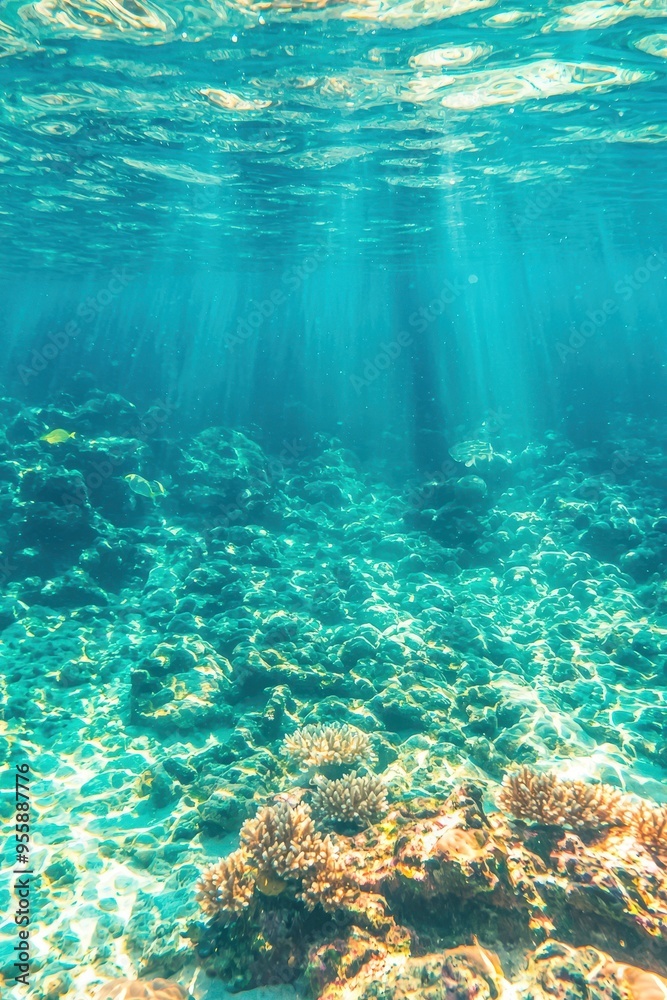 Obraz premium Underwater coral reef with sunbeams turquoise blue ocean water and colorful fish