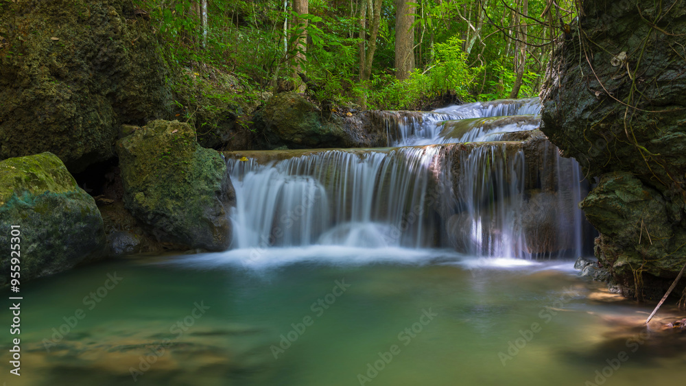 Fototapeta premium Deep forest waterfall in Thailand. Erawan waterfall National Park Kanjanaburi Thailand.