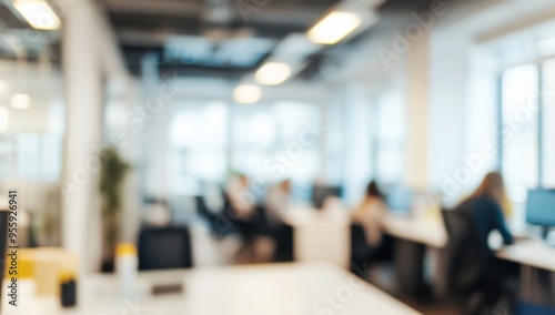 Blurred office interior with people working, featuring a modern white and light blue color scheme with yellow accents. Ideal for a business concept banner, with soft lighting and a clean, contemporary