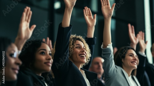 Diverse business group raising hands at conference event for team building an...