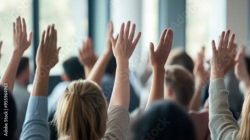 Diverse business group raising hands at conference event for team building an...