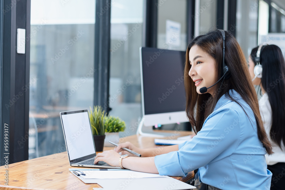 Young asian businesswoman with headset using desktop computer for customer support and online working in office, Call center helping for customers online concept. Young asian businesswoman with headset using desktop computer for customer support and online working in office, Call center helping for customers online concept.