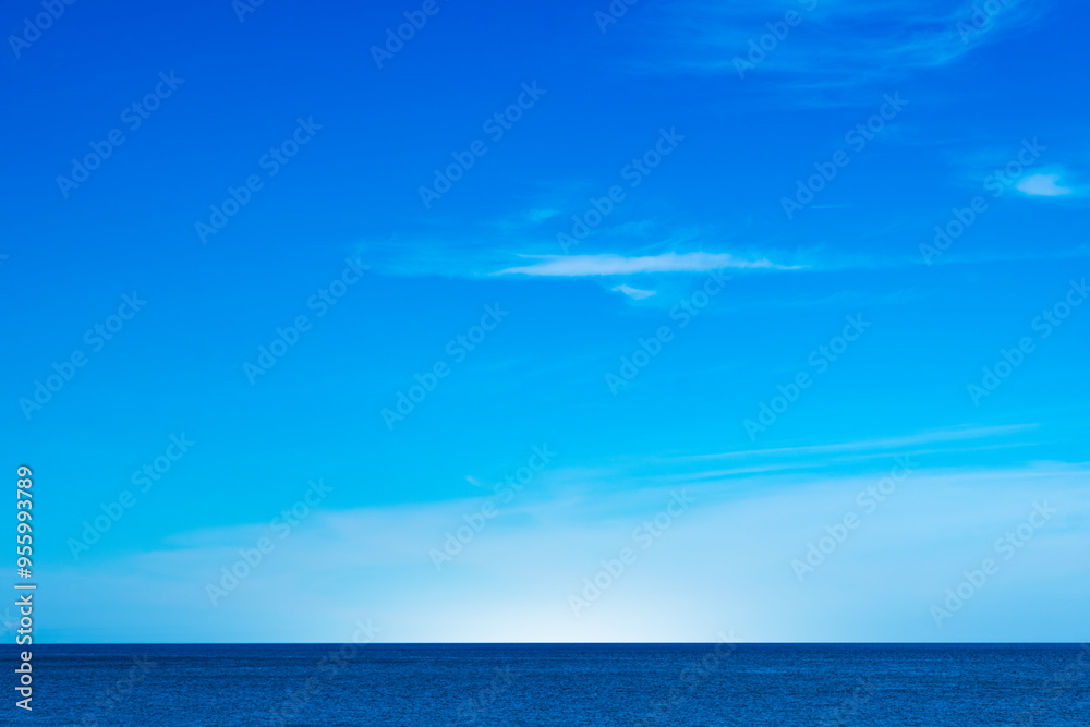Clear sky background for summer vacation concept at ocean and summer sea water with sunlight of beautiful cloudy sky.concept Clear sky background for summer vacation concept at ocean and summer sea water with sunlight of beautiful cloudy sky.concept