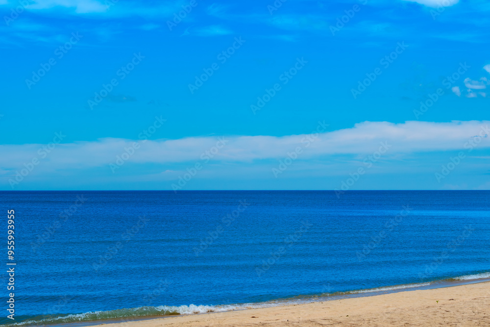 Nature of the beach and sea Summer with sunshine, sandy beaches, clear blue waters sparkling against the blue sky. On an island with good ecology and environment Background for summer vacation concept Nature of the beach and sea Summer with sunshine, sandy beaches, clear blue waters sparkling against the blue sky. On an island with good ecology and environment Background for summer vacation concept