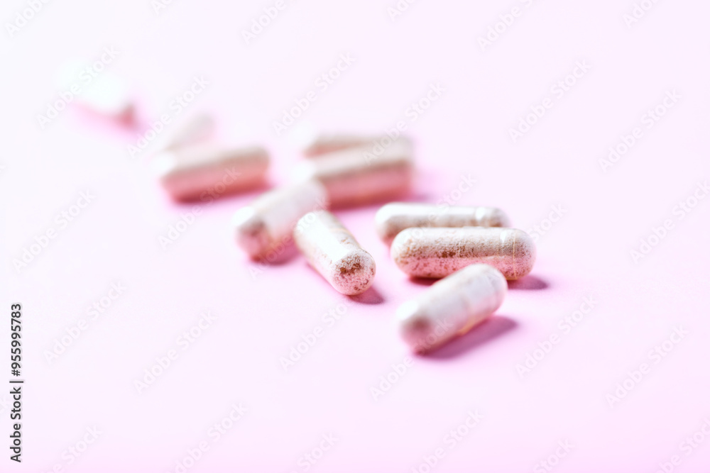 Collagen capsules. Bright paper background. Soft focus. Close up. Copy space. Collagen capsules. Bright paper background. Soft focus. Close up. Copy space.