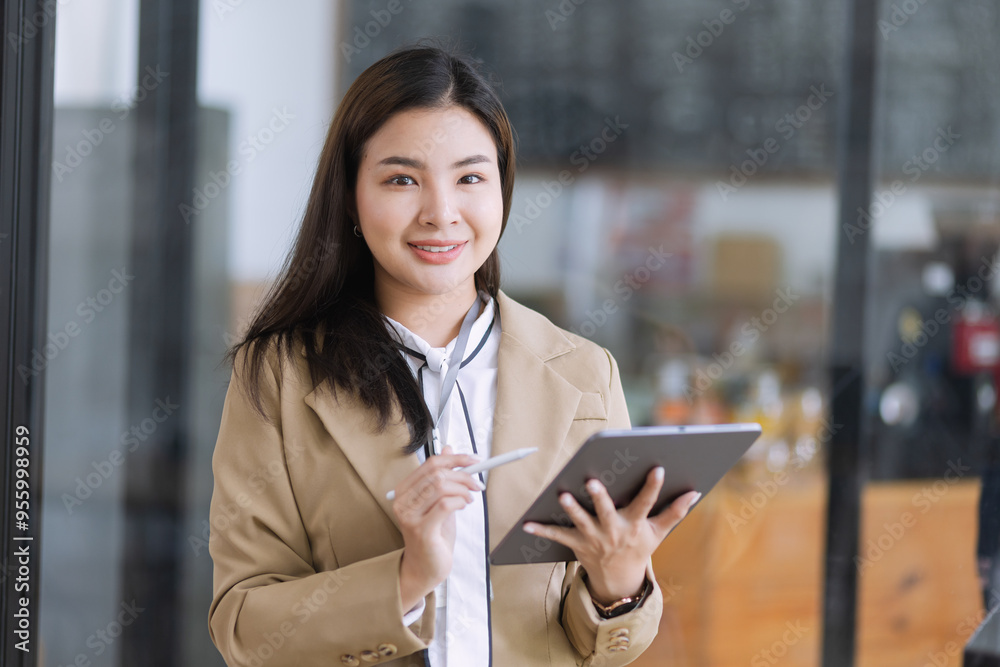 Young asian businesswoman using tablet to startup projects and business presentation plan. Young asian businesswoman using tablet to startup projects and business presentation plan.