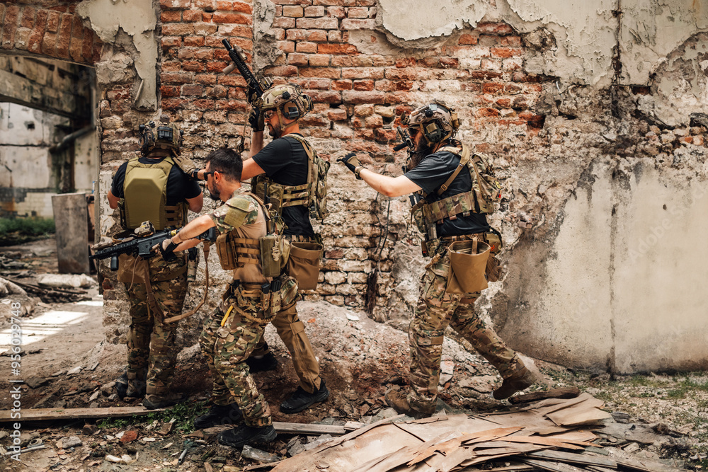 Group of army men with rifles and weapon at demolished building in action Group of army men with rifles and weapon at demolished building in action