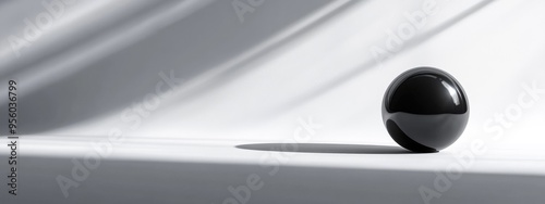 Monochrome abstract backdrop featuring a 3D rendered black sphere against a white backdrop