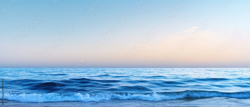 Fototapeta premium Panorama of sea waves on the background of dawn