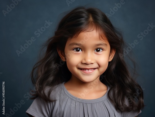 Charcoal background Happy Asian child Portrait of young beautiful Smiling child good mood Isolated on backdrop ethnic diversity equality acceptance 