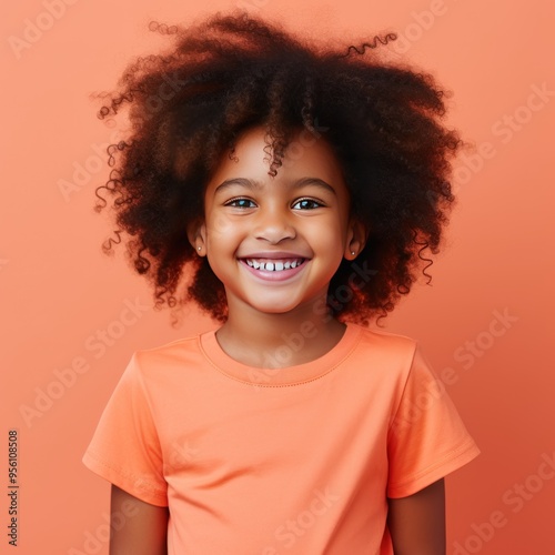 Coral background Happy black american african child Portrait of young beautiful kid Isolated on Background ethnic diversity equality acceptance 