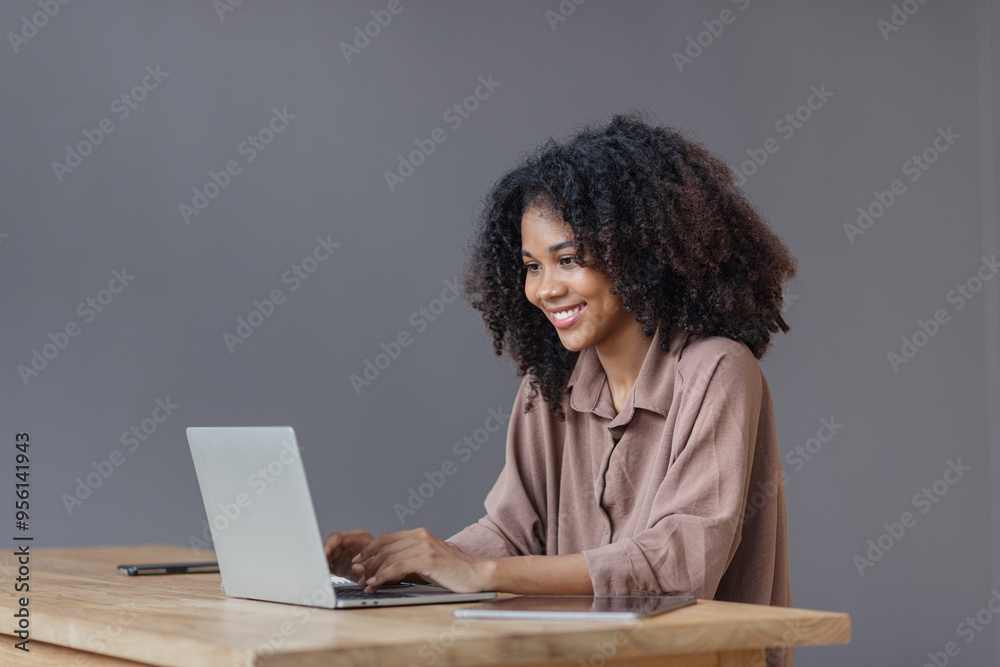 Excited African American woman with laptop. Excited African American woman with laptop.