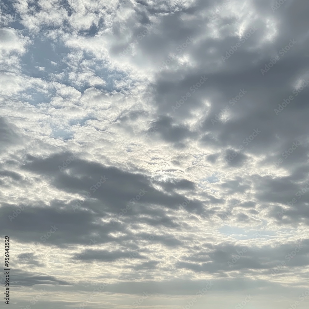 A cloudy sky with patches of blue peeking through. A cloudy sky with patches of blue peeking through.