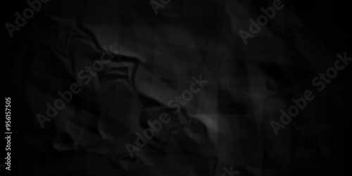 crumpled texture of dark black wrinkle chaotic paper. old crumple black paper sheet abstract shape background space for text.	
