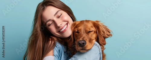 Woman hugging a friendly golden retriever, both smiling photo