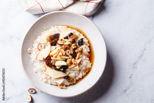 Bircher muesli with apple, raisins and nuts. photo