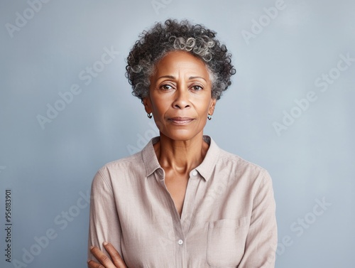 Cream background sad black American independent powerful Woman. Portrait of older mid-aged person beautiful bad mood expression girl Isolated photo