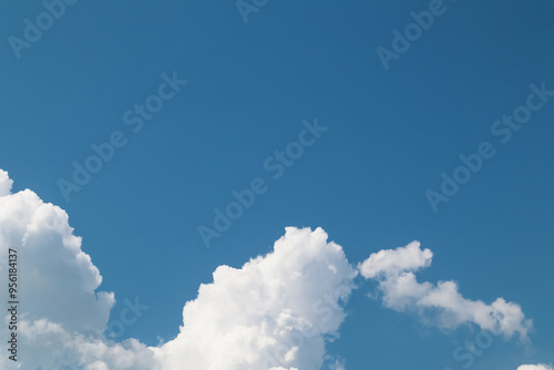 Clouds In Blue Sky. Clear blue skies with fluffy white clouds. photo