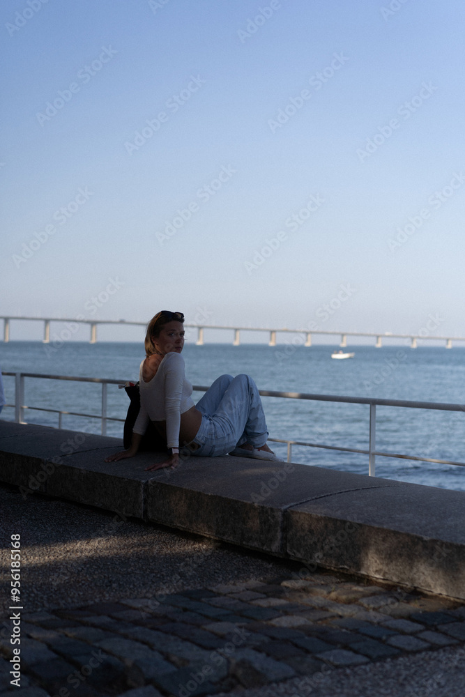 Woman near Vasco da Gama Bridge (Ponte Vasco da Gama), Lisbon. Woman near Vasco da Gama Bridge (Ponte Vasco da Gama), Lisbon.