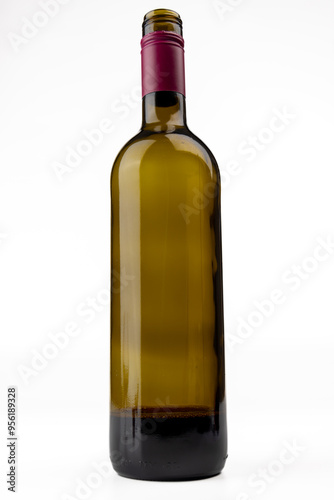 Vertical Shot of Central Wine Bottle on White Surface