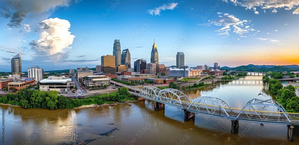 Naklejka premium This stunning photograph offers a panoramic view of Nashville's skyline, highlighting the city's modern architecture and its connection to the Cumberland River.