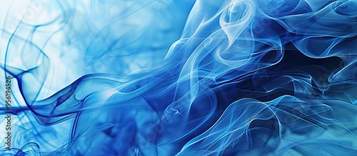 Blue incense smoke creates an abstract copy space image