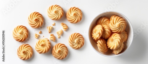 Varians Danish butter cookies displayed on a white background with copy space Includes whole and broken cookies suitable for design elements baked goods sweet treats and commercial purposes photo