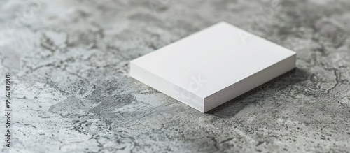 Close up mockup showing blank business cards on a light textured table with ample copy space image