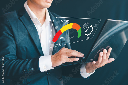 Risk Management Businessman Touching Virtual Risk Level Indicator From Low To High For Financial And Business Analysis Financial Risk Assessment Project Risk Mitigation Investment Strategy photo