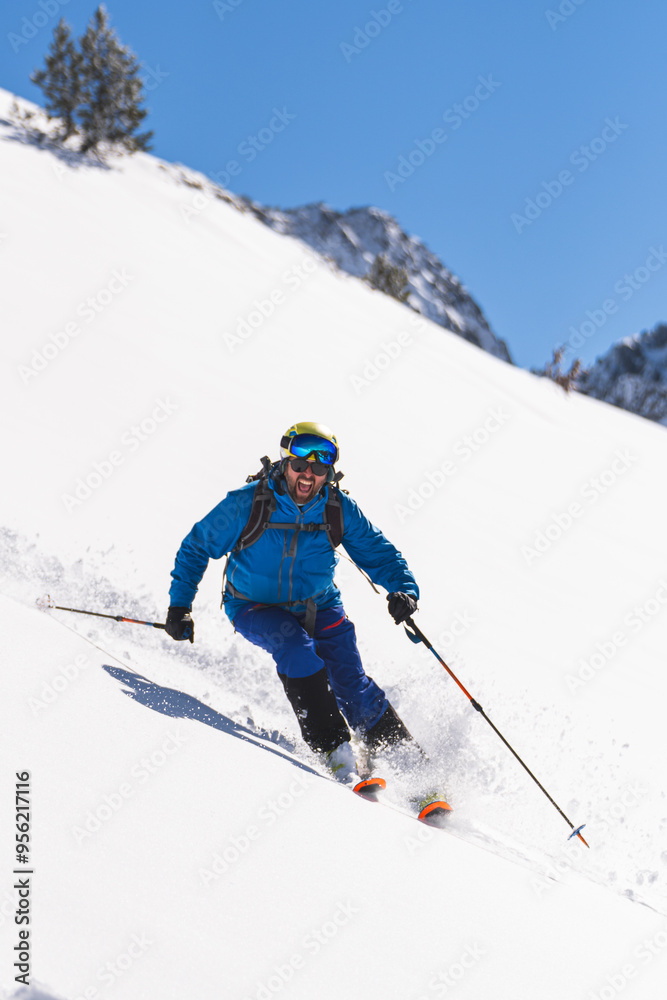 Cheerful skier skiing on snow in winter Cheerful skier skiing on snow in winter