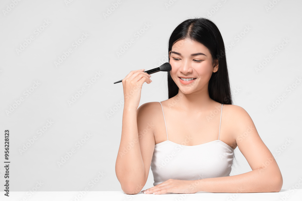 Beautiful Asian young woman smile and holding make up brush with healthy Clean and Fresh skin feeling so happiness and cheerful,Isolated on white background. Beauty Cosmetics Concept. Beautiful Asian young woman smile and holding make up brush with healthy Clean and Fresh skin feeling so happiness and cheerful,Isolated on white background. Beauty Cosmetics Concept.