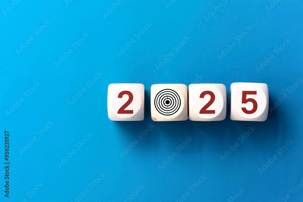 2025 Happy New year background banner. Numbers on white dices on target icon on wooden cube blocks stacked on blue background with copy space. 2025 Happy New year background banner. Numbers on white dices on target icon on wooden cube blocks stacked on blue background with copy space.