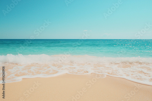 Beautiful sandy beach and soft blue ocean wave, top view.