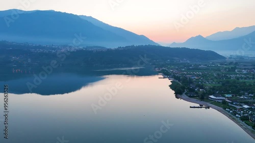 Tranquil Caldonazzo lake in pre-dawn drone shot photo