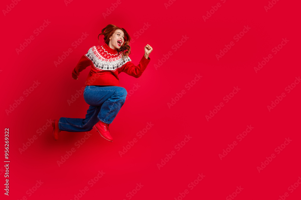 Full size photo of young pretty woman jump run empty space ad new year isolated on red color background Full size photo of young pretty woman jump run empty space ad new year isolated on red color background