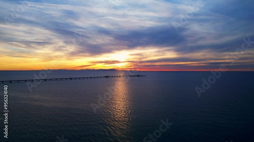 Aerial view of a gas pipeline over the sea at sunset