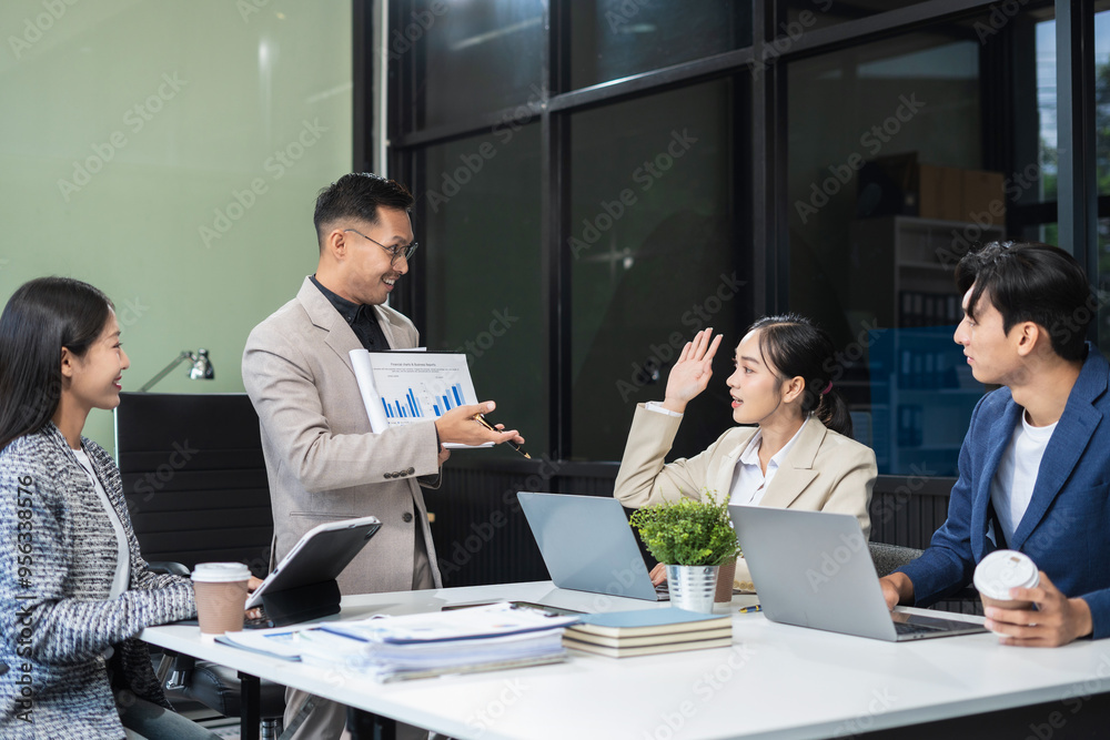 Business, technology and office concept, businessman with laptop, tablet pc computer and papers having discussion in modern office. Business, technology and office concept, businessman with laptop, tablet pc computer and papers having discussion in modern office.