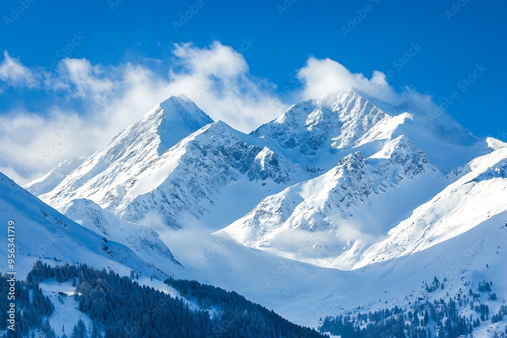 Majestic Snowy Mountains with a Clear Blue Sky and Fluffy Clouds Majestic Snowy Mountains with a Clear Blue Sky and Fluffy Clouds