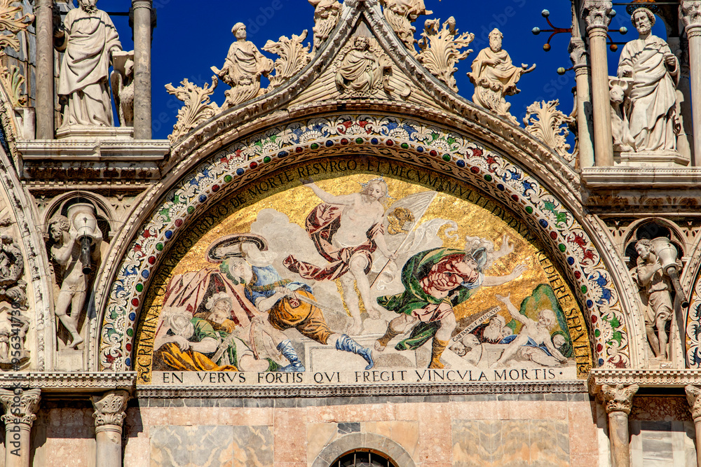 Fototapeta premium Basilica di San Marco or St Mark's Basilica, Venice, Italy. It is the main travel attraction of Venice. Luxury facade of St Mark's church close-up. Ornate detail of landmark of Venice in summer.