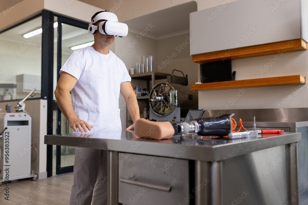 Using VR headset, man working in prosthetic lab with artificial limb on table, copy space Using VR headset, man working in prosthetic lab with artificial limb on table, copy space
