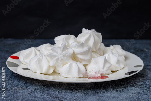 Obraz na płótnie Porcelain plate full of fluffy white meringue. Indoors close-up. w salonie