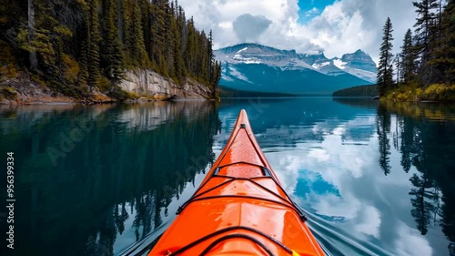 Kayaking Through Crystal Clear Waters Towards Majestic Mountains, A Tranquil Escape into Nature