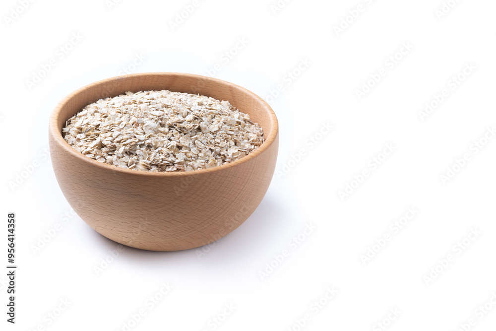 Rolled oats, healthy breakfast cereal oat flakes in bowl isolated on white background. Copy space Rolled oats, healthy breakfast cereal oat flakes in bowl isolated on white background. Copy space