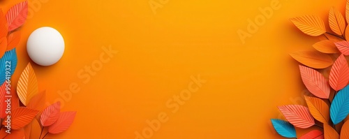 White ball on orange background with colorful leaves.