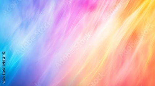 Abstract background of vibrant rainbow colors in soft focus, resembling the ethereal glow of the Aurora Borealis. 